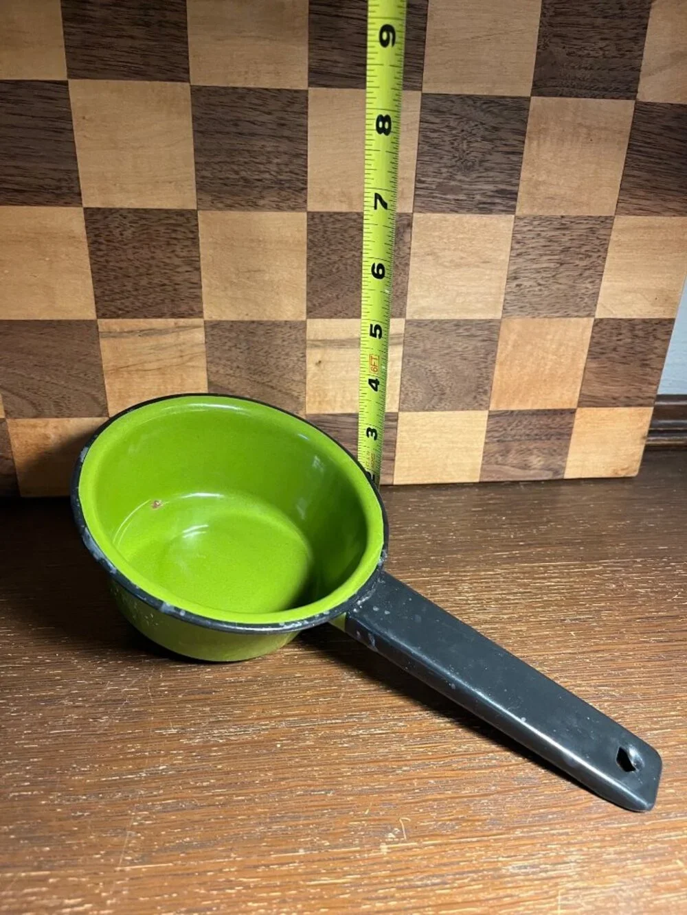 Vintage Small Avocado Green Enamel Pan with Black Handle, shows wear